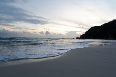 Scenic view of beach against sky during sunset