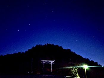 Built structure against blue sky at night