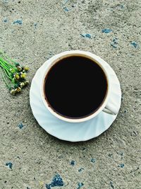 High angle view of black coffee on table