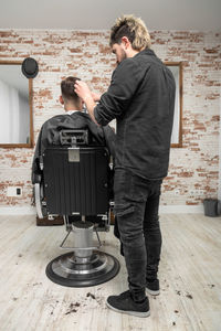 Side view of man using mobile phone