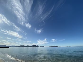 Scenic view of sea against blue sky