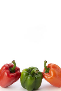 Close-up of bell peppers on white background