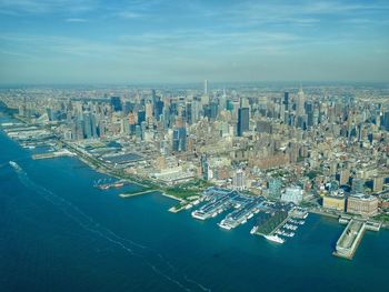 Aerial view of cityscape against sky