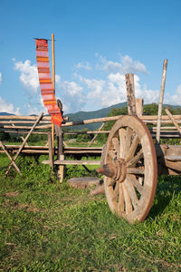 Old abandoned truck on field against sky