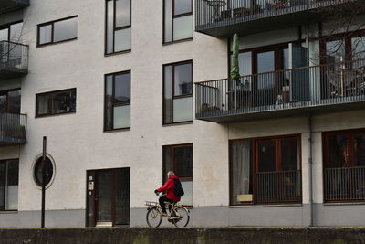 Man riding bicycle on building