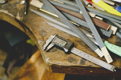 High angle view of digital caliper on workbench in jewelry workshop