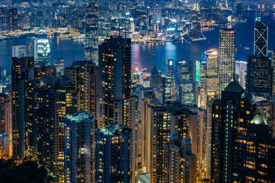 High angle view of city lit up at night