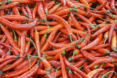 Full frame shot of red chili peppers for sale at market stall