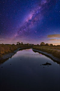 Scenic view of sea against sky at night