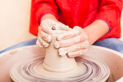 Girl working on pottery wheel