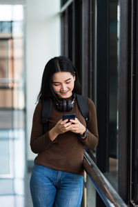 Young woman using mobile phone