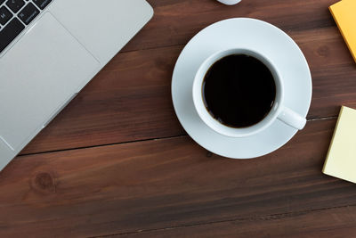 High angle view of coffee cup on table