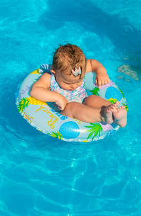 High angle view of woman swimming in pool