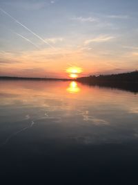 Scenic view of lake against romantic sky at sunset