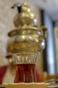 Close-up of glass of jar on table