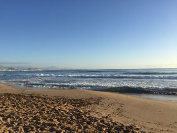 Scenic view of beach against clear sky