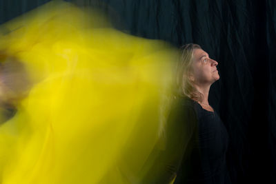 Time lapse view of woman moving a rag. long exposure, motion blur. 