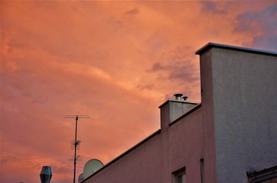 Low angle view of building against sky during sunset