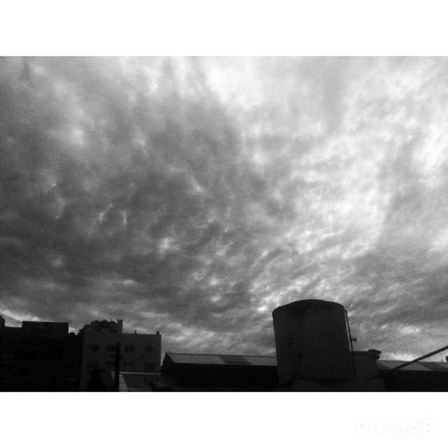 transfer print, sky, cloud - sky, architecture, built structure, cloudy, building exterior, low angle view, auto post production filter, silhouette, overcast, weather, cloud, dusk, storm cloud, city, outdoors, no people, tower, building