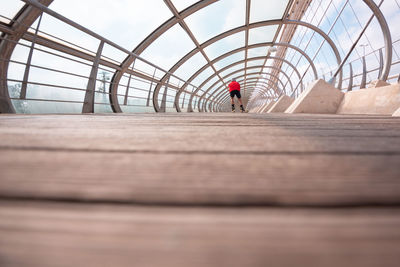 Athlete ski rolling on bridge