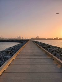 Scenic view of sea against clear sky during sunset