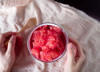 Close-up of woman holding ice cream in bowl