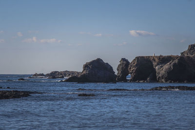 View of calm sea against blue sky