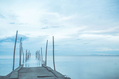 Pier over sea against sky