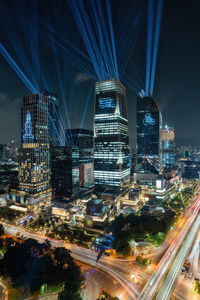 High angle view of illuminated buildings in city at night