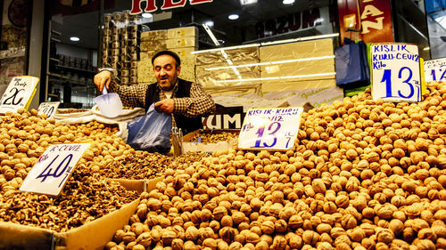 Woman at market stall