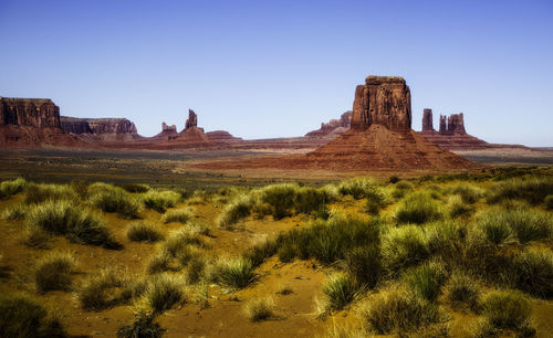 Rock formations on landscape against clear sky