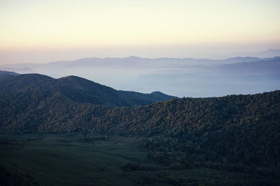 Scenic view of landscape against sky during sunset