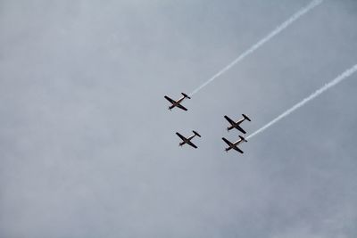 Low angle view of airplane flying in sky