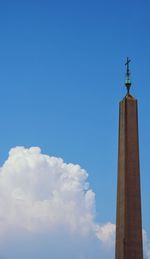 Low angle view of building against cloudy sky