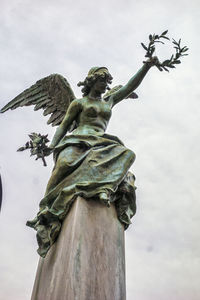 Low angle view of statue against sky