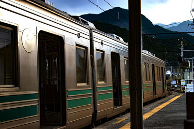 Train at railroad station against sky