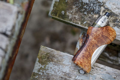 High angle view of rusty metal on wood