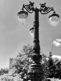 Low angle view of street light against sky