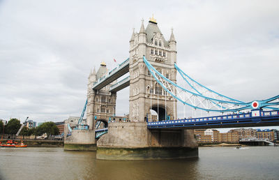 Low angle view of tower bridge over thames river against sky in city