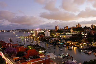 High angle view of illuminated buildings against sky at sunset