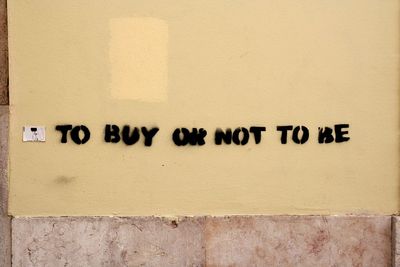 Close-up of text on wall