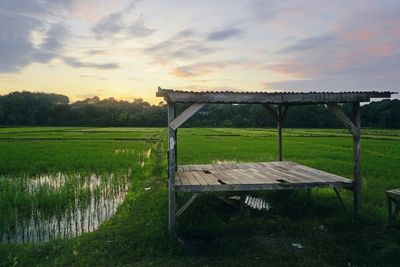 Scenic view of field against sky during sunset