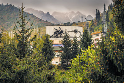 High angle view of trees and buildings against sky