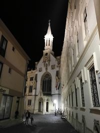 Low angle view of illuminated building at night