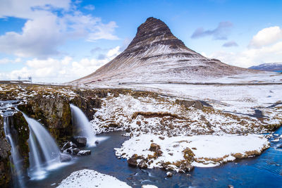 Snow covered mountain against sky