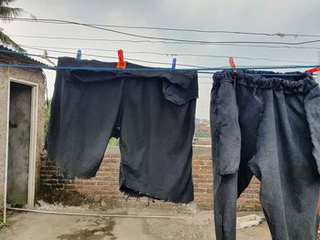 Clothes drying on clothesline against buildings