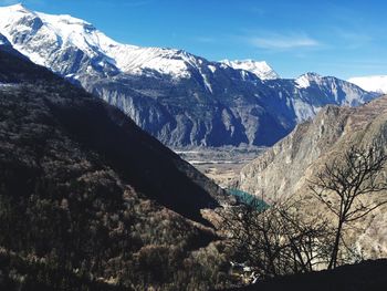 Scenic view of snowcapped mountains against sky