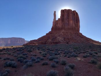 Rock formations on landscape against clear sky