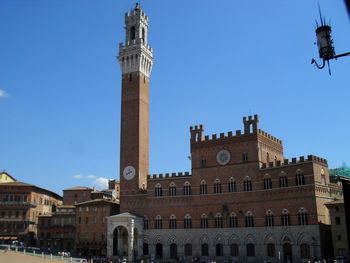 Low angle view of building against blue sky