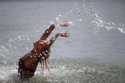 High angle view of man with dog in water